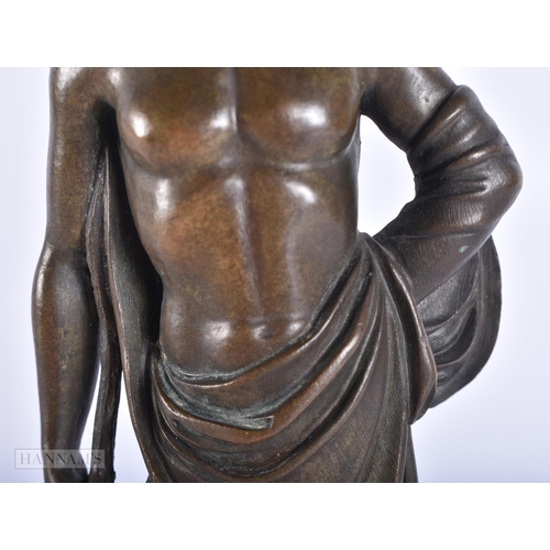 418 - A 19TH CENTURY EUROPEAN GRAND TOUR BRONZE FIGURE OF A MALE modelled upon a labradorite base. 21.5 cm... 