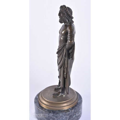 418 - A 19TH CENTURY EUROPEAN GRAND TOUR BRONZE FIGURE OF A MALE modelled upon a labradorite base. 21.5 cm... 