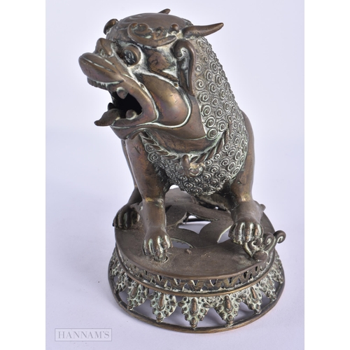 42 - AN 18TH/19TH CENTURY INDIAN PERSIAN BRONZE BEAST modelled scowling. 18cm x 15cm.