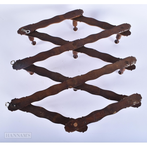 429 - AN AESTHETIC MOVEMENT CARVED WOOD FOLDING COAT RACK. 120 cm long extended.