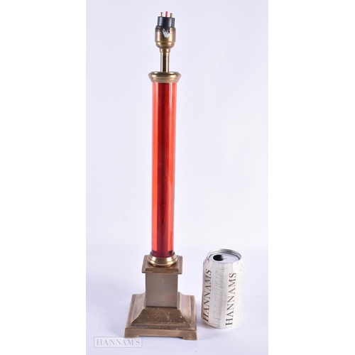 44 - AN UNUSUAL RUBY STEM BRASS LAMP. 46 cm high.