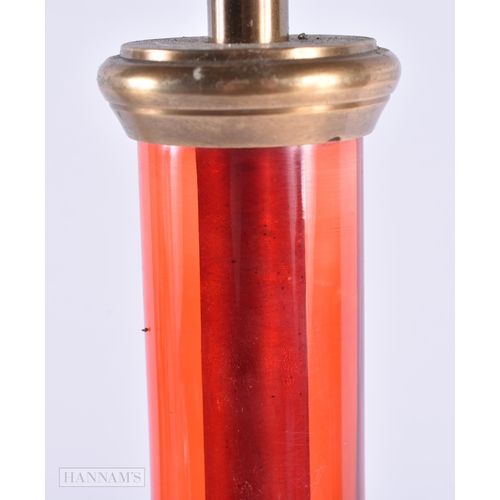 44 - AN UNUSUAL RUBY STEM BRASS LAMP. 46 cm high.