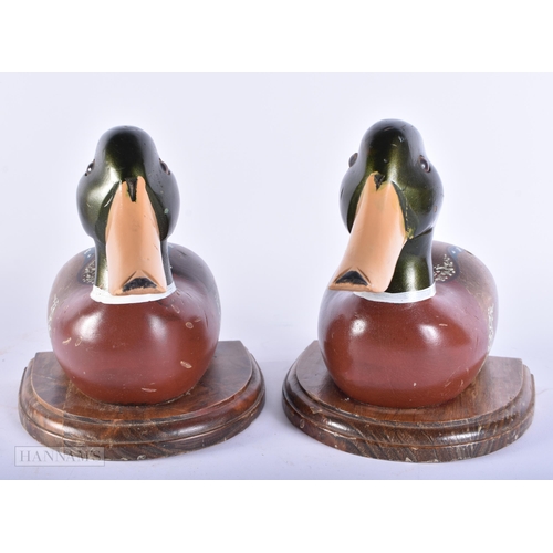 445 - AN UNUSUAL PAIR OF PAINTED WOOD FOLK ART DUCK BOOKENDS. Each end 18cm x 18cm.