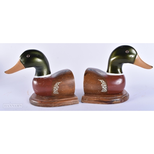 445 - AN UNUSUAL PAIR OF PAINTED WOOD FOLK ART DUCK BOOKENDS. Each end 18cm x 18cm.