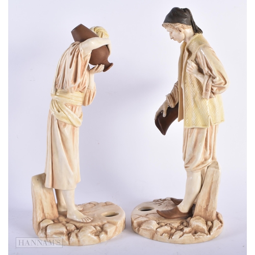 466 - A PAIR OF ROYAL WORCESTER BLUSH IVORY PORCELAIN WATER CARRIERS. Largest 34 cm high. (2)