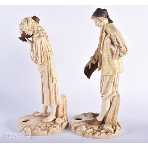 466 - A PAIR OF ROYAL WORCESTER BLUSH IVORY PORCELAIN WATER CARRIERS. Largest 34 cm high. (2)