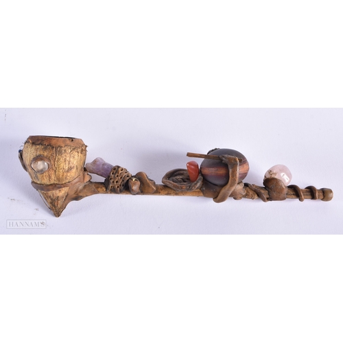 467 - A TRIBAL PIPE together with an agateware porcelain pen dish etc. (4)