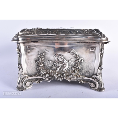 470 - A LARGE VICTORIAN WALKER & HALL SILVER PLATED REPOUSSE CASKET decorated with figures within landscap... 