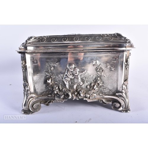 470 - A LARGE VICTORIAN WALKER & HALL SILVER PLATED REPOUSSE CASKET decorated with figures within landscap... 