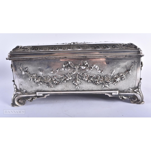 470 - A LARGE VICTORIAN WALKER & HALL SILVER PLATED REPOUSSE CASKET decorated with figures within landscap... 