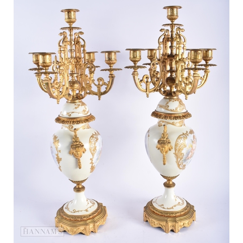 471 - A LARGE PAIR OF LATE 19TH CENTURY FRENCH SEVRES PORCELAIN CANDLESTICKS mounted in gilt bronze, paint... 