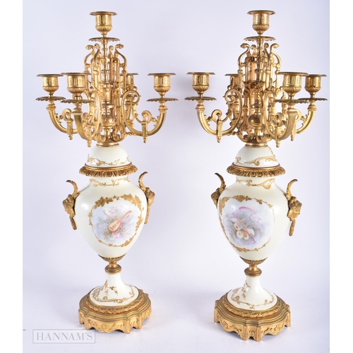 471 - A LARGE PAIR OF LATE 19TH CENTURY FRENCH SEVRES PORCELAIN CANDLESTICKS mounted in gilt bronze, paint... 