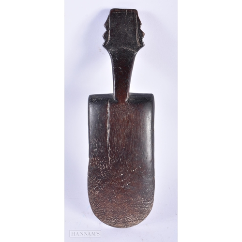 475 - A TRIBAL CARVED WOOD LIME SPATULA. 24 cm long.