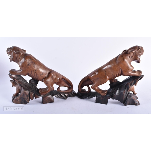 496 - AN AFRICAN TRIBAL CARVED WOOD FIGURE together with a pair of Oriental carved wood tigers and an over... 