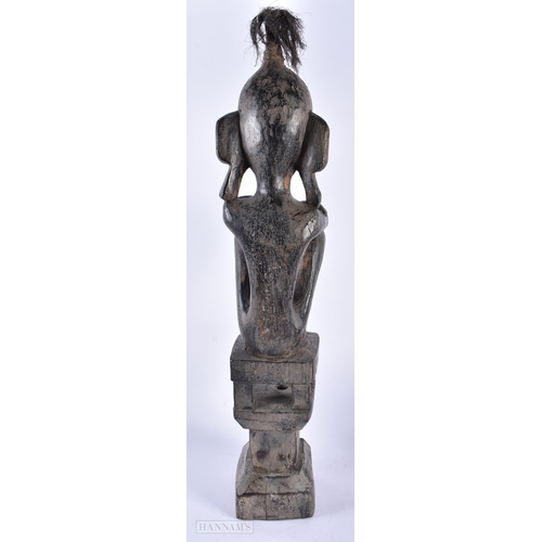 496 - AN AFRICAN TRIBAL CARVED WOOD FIGURE together with a pair of Oriental carved wood tigers and an over... 