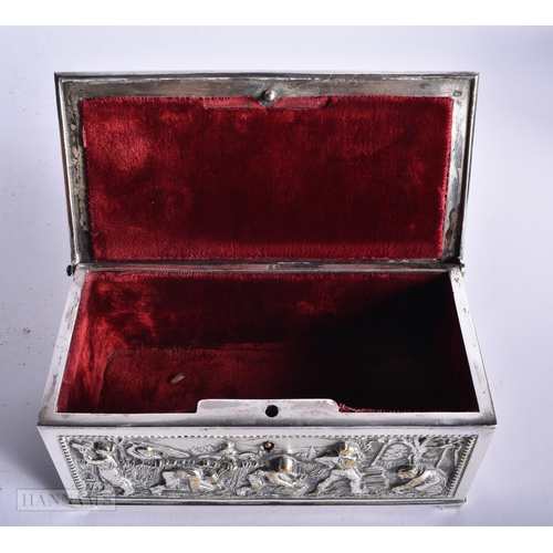 502 - AN ANTIQUE SILVER PLATED REPOUSSE CASKET together with a rosewood box. Largest 23 cm wide. (2)