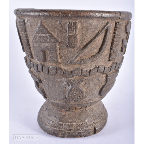 506 - AN AFRICAN TRIBAL CARVED WOOD MORTAR possibly Loango. 23 cm x 17 cm.