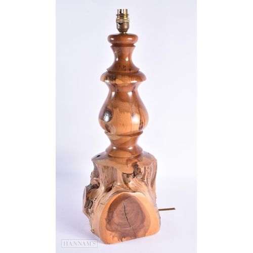 51 - A LARGE EARLY 20TH CENTURY YEW WOOD RUSTIC LAMP of naturalistic form. 52 cm x 22cm.