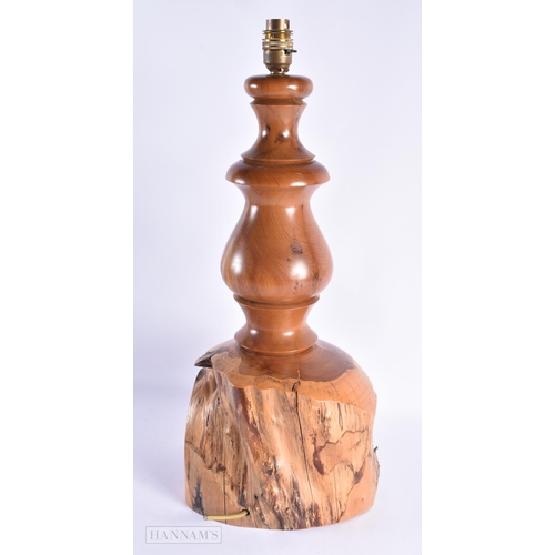 51 - A LARGE EARLY 20TH CENTURY YEW WOOD RUSTIC LAMP of naturalistic form. 52 cm x 22cm.