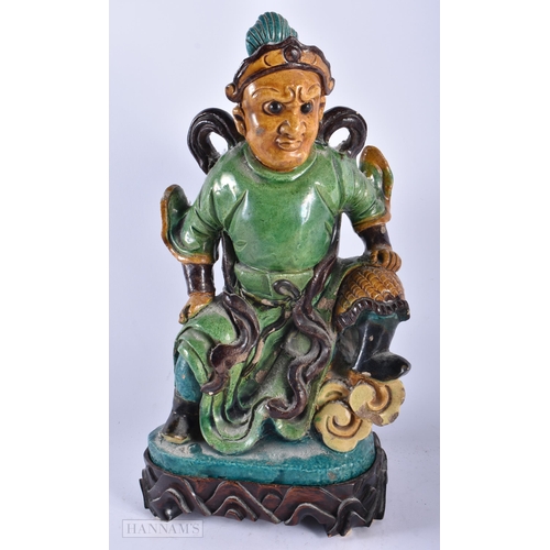 510 - A LARGE 19TH CENTURY CHINESE SANCAI GLAZED POTTERY FIGURE Qing, together with a canton famille rose ... 