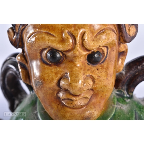 510 - A LARGE 19TH CENTURY CHINESE SANCAI GLAZED POTTERY FIGURE Qing, together with a canton famille rose ... 