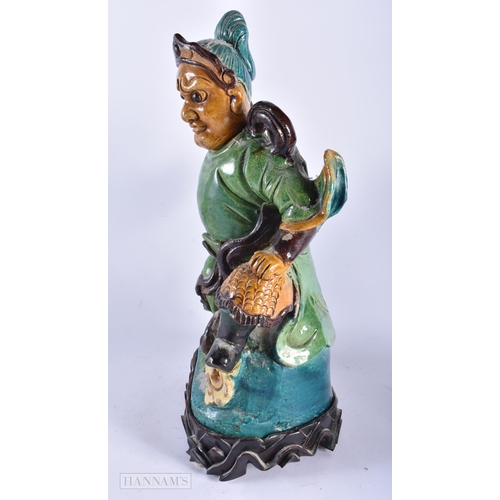 510 - A LARGE 19TH CENTURY CHINESE SANCAI GLAZED POTTERY FIGURE Qing, together with a canton famille rose ... 