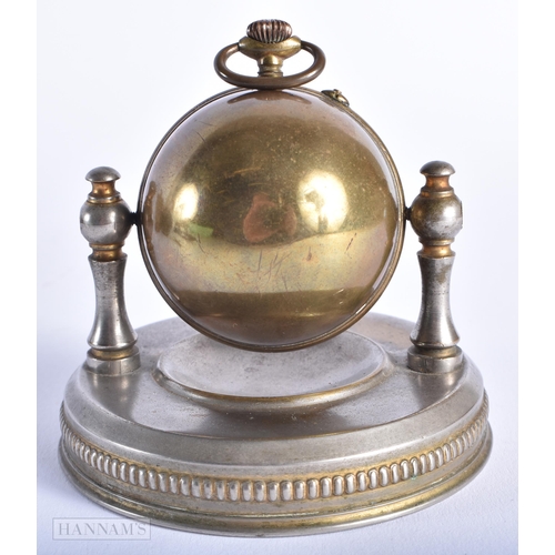 515 - AN ART DECO POCKET WATCH ON STAND together with military collectables. (qty) Not running