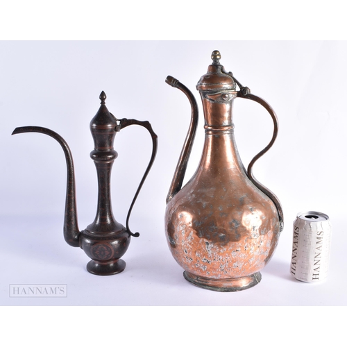 52 - A LARGE EARLY ISLAMIC PERSIAN COPPER ALLOY EWER together with an enamelled Indian ewer. Largest 40 c... 