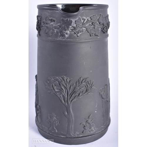 520 - A WEDGWOOD BLACK BASALT JUG. 15cm high.