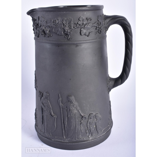 520 - A WEDGWOOD BLACK BASALT JUG. 15cm high.