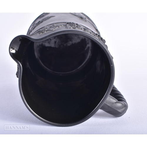 520 - A WEDGWOOD BLACK BASALT JUG. 15cm high.