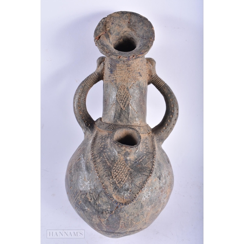 521 - AN AFRICAN TRIBAL POTTERY FIGURAL JUG possibly Cameroon. 28cm high.