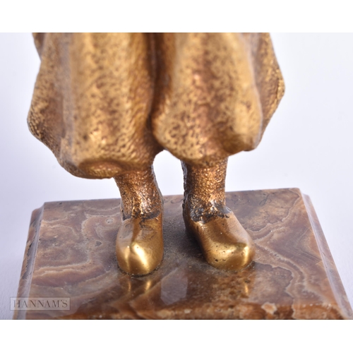 523 - AN ART DECO FRENCH GILT BRONZE FIGURE OF A YOUNG GIRL. 17 cm high.