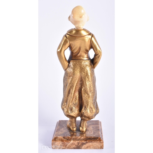 523 - AN ART DECO FRENCH GILT BRONZE FIGURE OF A YOUNG GIRL. 17 cm high.