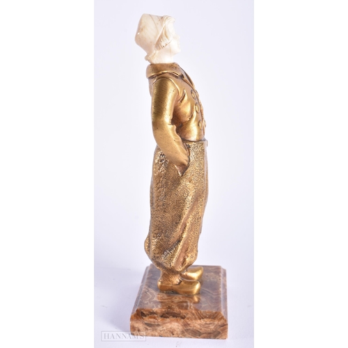 523 - AN ART DECO FRENCH GILT BRONZE FIGURE OF A YOUNG GIRL. 17 cm high.