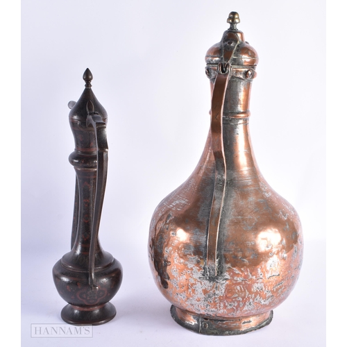 52 - A LARGE EARLY ISLAMIC PERSIAN COPPER ALLOY EWER together with an enamelled Indian ewer. Largest 40 c... 