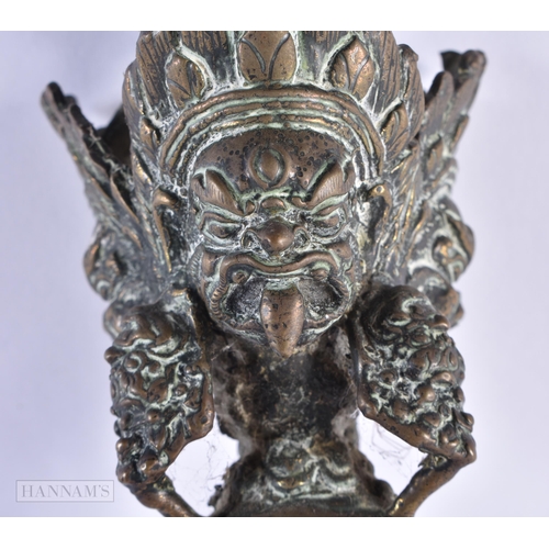 53 - A RARE LARGE 17TH/18TH CENTURY INDO TIBETAN BRONZE PHURBA formed with numerous buddhistic mask heads... 