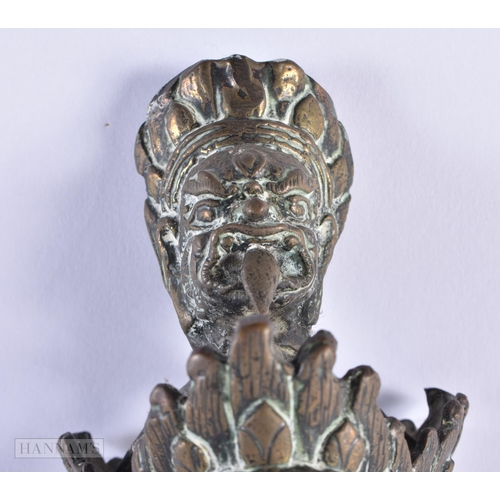 53 - A RARE LARGE 17TH/18TH CENTURY INDO TIBETAN BRONZE PHURBA formed with numerous buddhistic mask heads... 