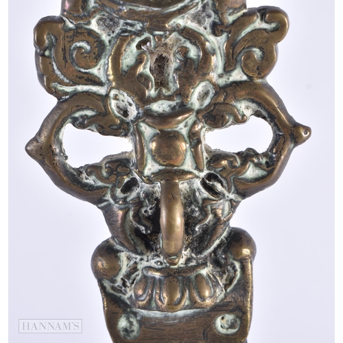 53 - A RARE LARGE 17TH/18TH CENTURY INDO TIBETAN BRONZE PHURBA formed with numerous buddhistic mask heads... 