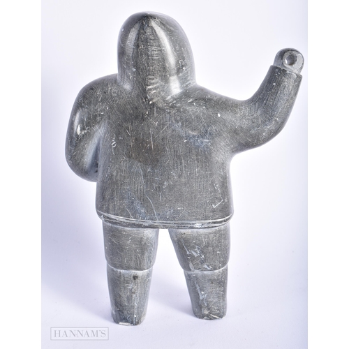 542 - AN ANTIQUE NORTH AMERICAN INUIT TRIBAL CARVED STONE FIGURE OF A HUNTER. 15cm x 9 cm.