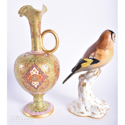 543 - A 19TH CENTURY ENGLISH ISLAMIC MARKET PORCELAIN JUG together with a Royal Worcester bird. Largest 20... 