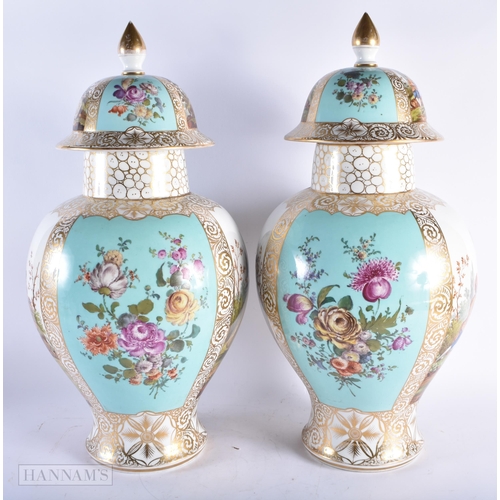 552 - A VERY LARGE PAIR OF LATE 19TH CENTURY GERMAN DRESDEN PORCELAIN VASES AND COVER painted with lovers ... 