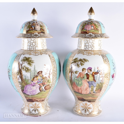 552 - A VERY LARGE PAIR OF LATE 19TH CENTURY GERMAN DRESDEN PORCELAIN VASES AND COVER painted with lovers ... 