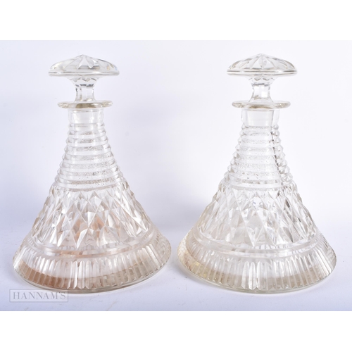 555 - A PAIR OF CUT GLASS SHIPS DECANTERS AND STOPPERS. 24 cm x 13 cm.