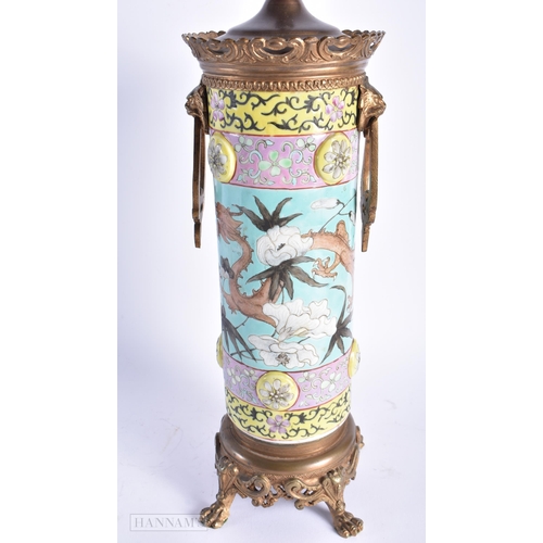 559 - A LARGE 19TH CENTURY CHINESE DAYA ZHAI PORCELAIN LAMP Qing, together with a famille noire figure. La... 