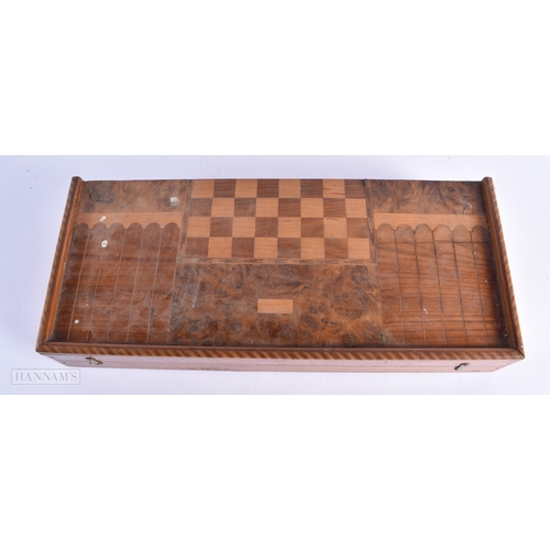 56 - A LARGE EARLY 20TH CENTURY MIXED WOOD FOLDING GAMING BOARD with counters. 54 cm x 46cm open.