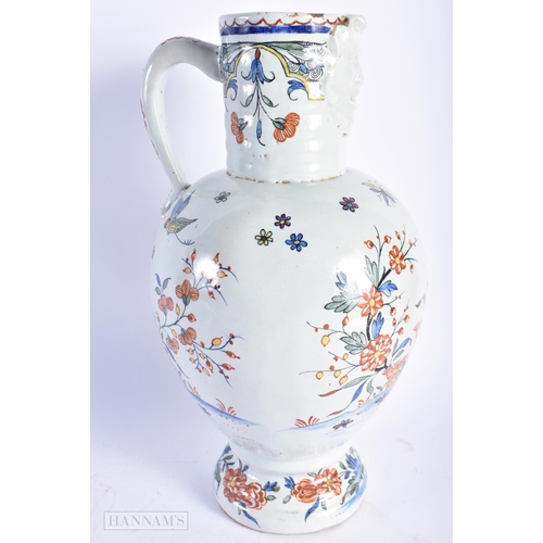 560 - A LARGE ANTIQUE DELFT TIN GLAZED POTTERY JUG. 29 cm high.