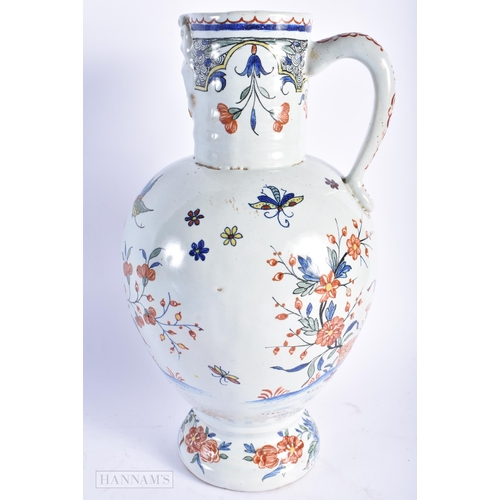 560 - A LARGE ANTIQUE DELFT TIN GLAZED POTTERY JUG. 29 cm high.