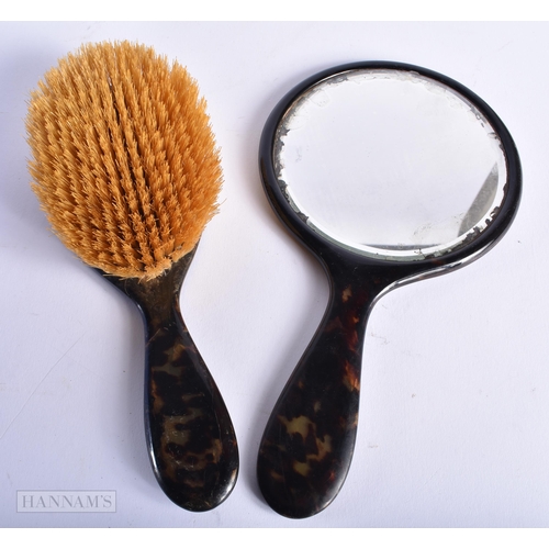 561 - TWO ANTIQUE GOLD OVERLAID TORTOISESHELL DRESSING TABLE ITEMS. Largest 24 cm long. (2)