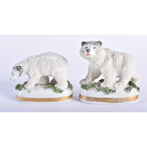 564 - A PAIR OF ANTIQUE ANTLERS together with two staffordshire polar bears. Largest 18cm x 12 cm. (3)